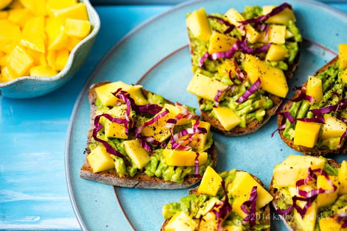 Platter of avocado toast with fruit