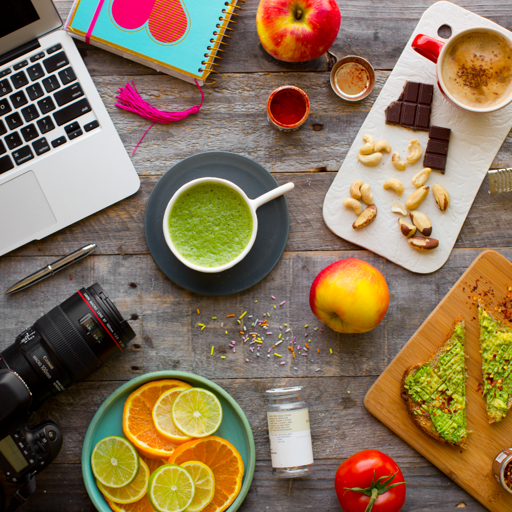 work from home creative spread laptop, camera, food