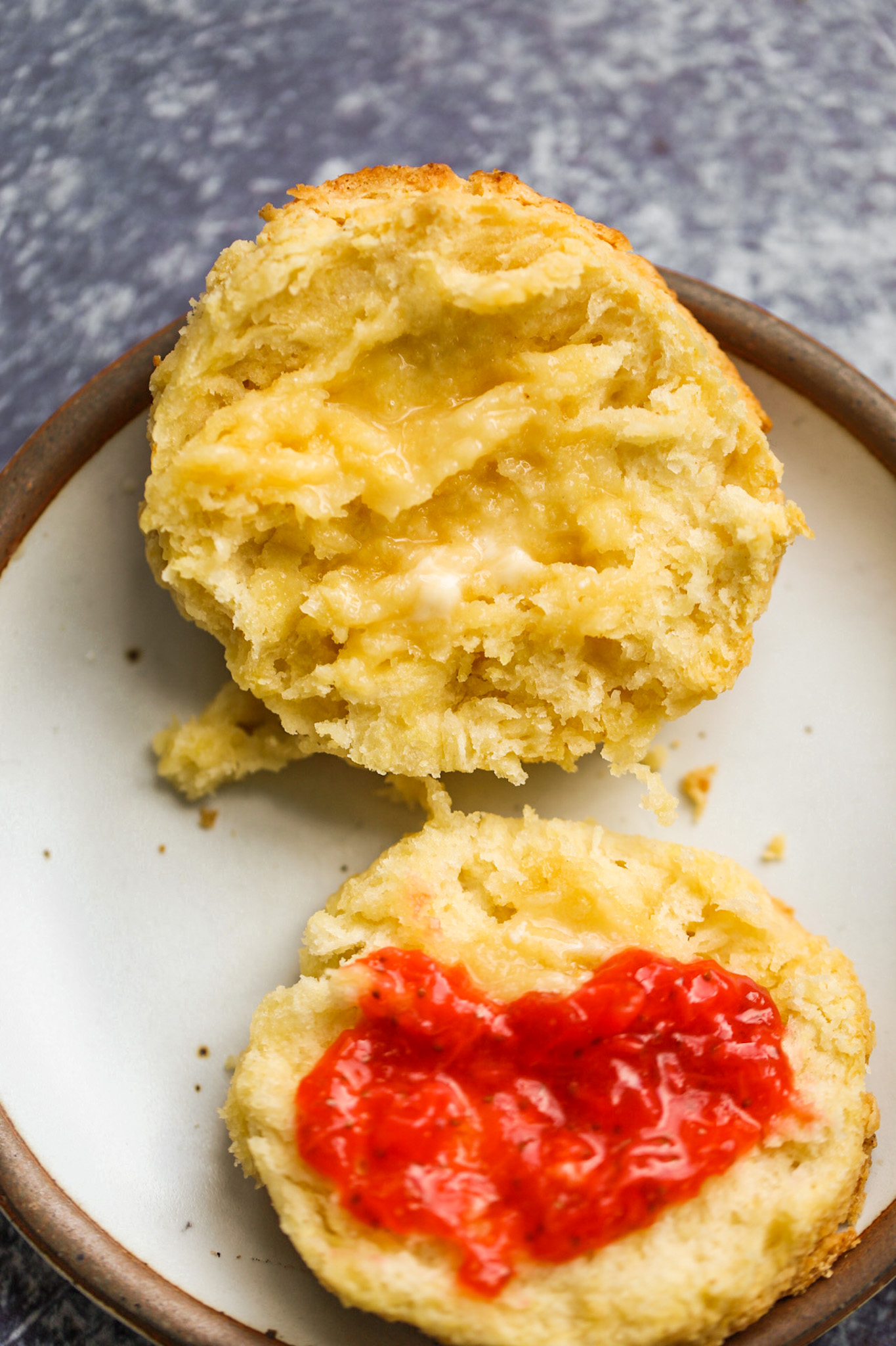 open biscuit with jam and butter