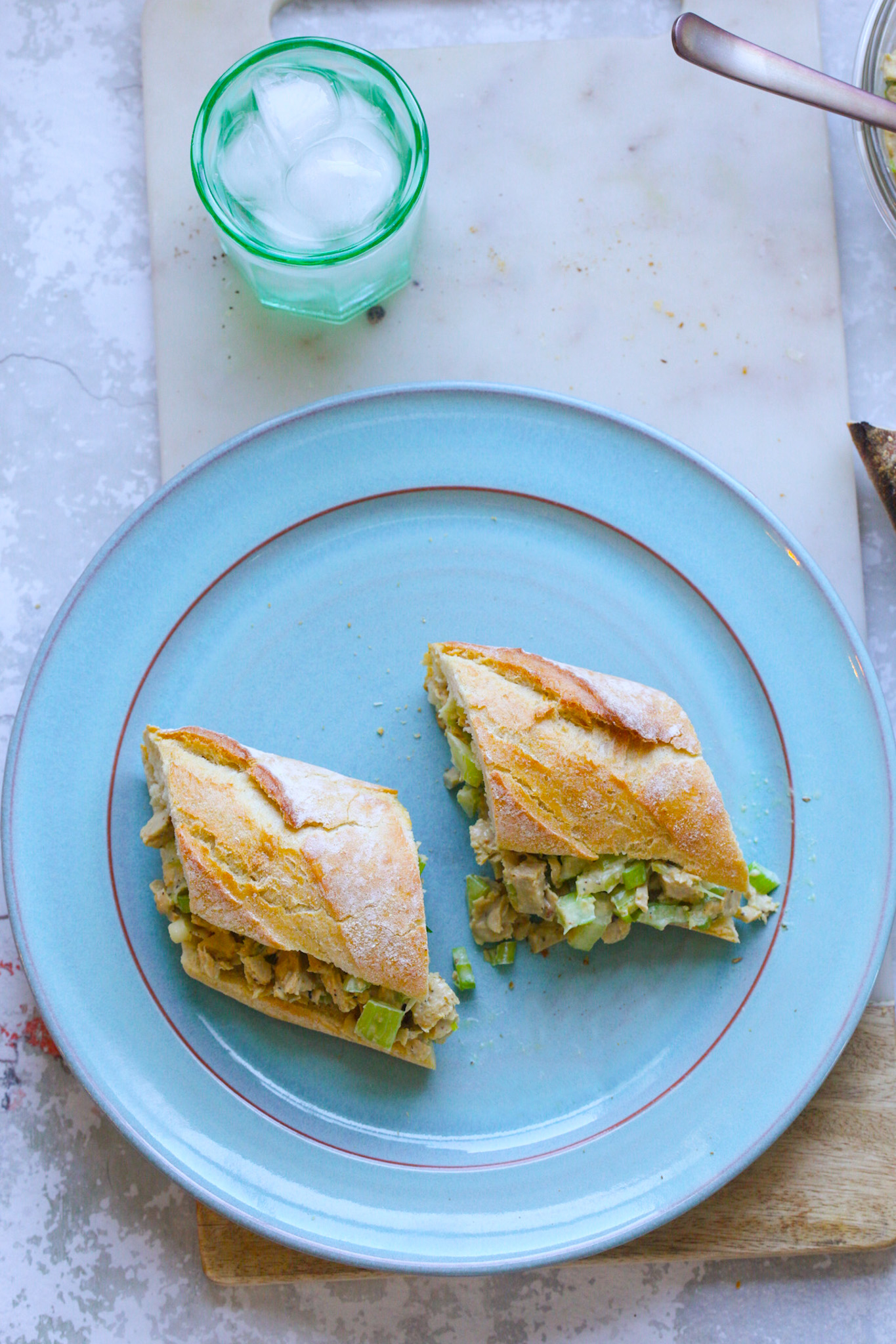 vegan chick'n salad sandwich on bread for lunch, turquoise plate