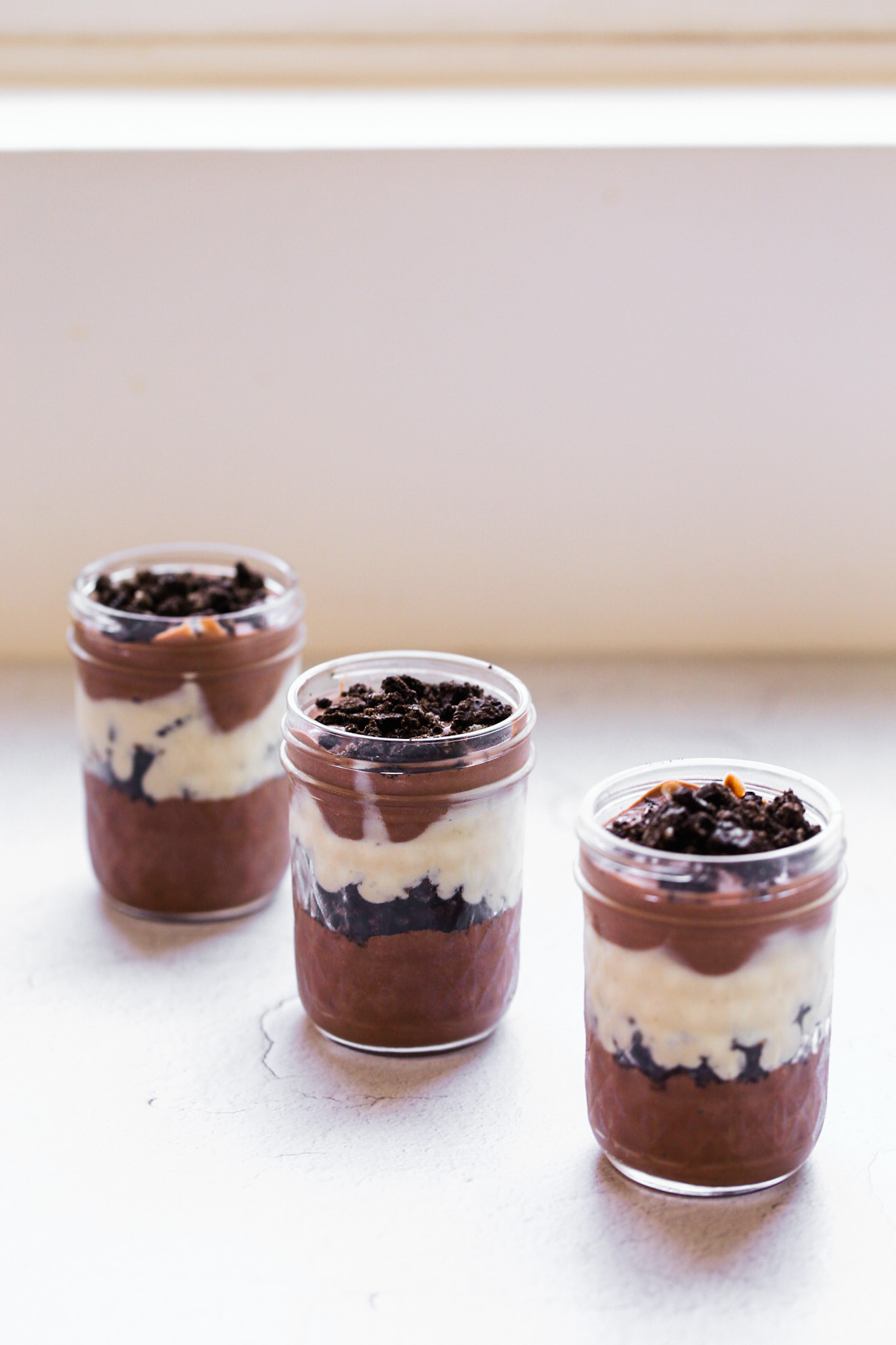 three pudding parfait in jars