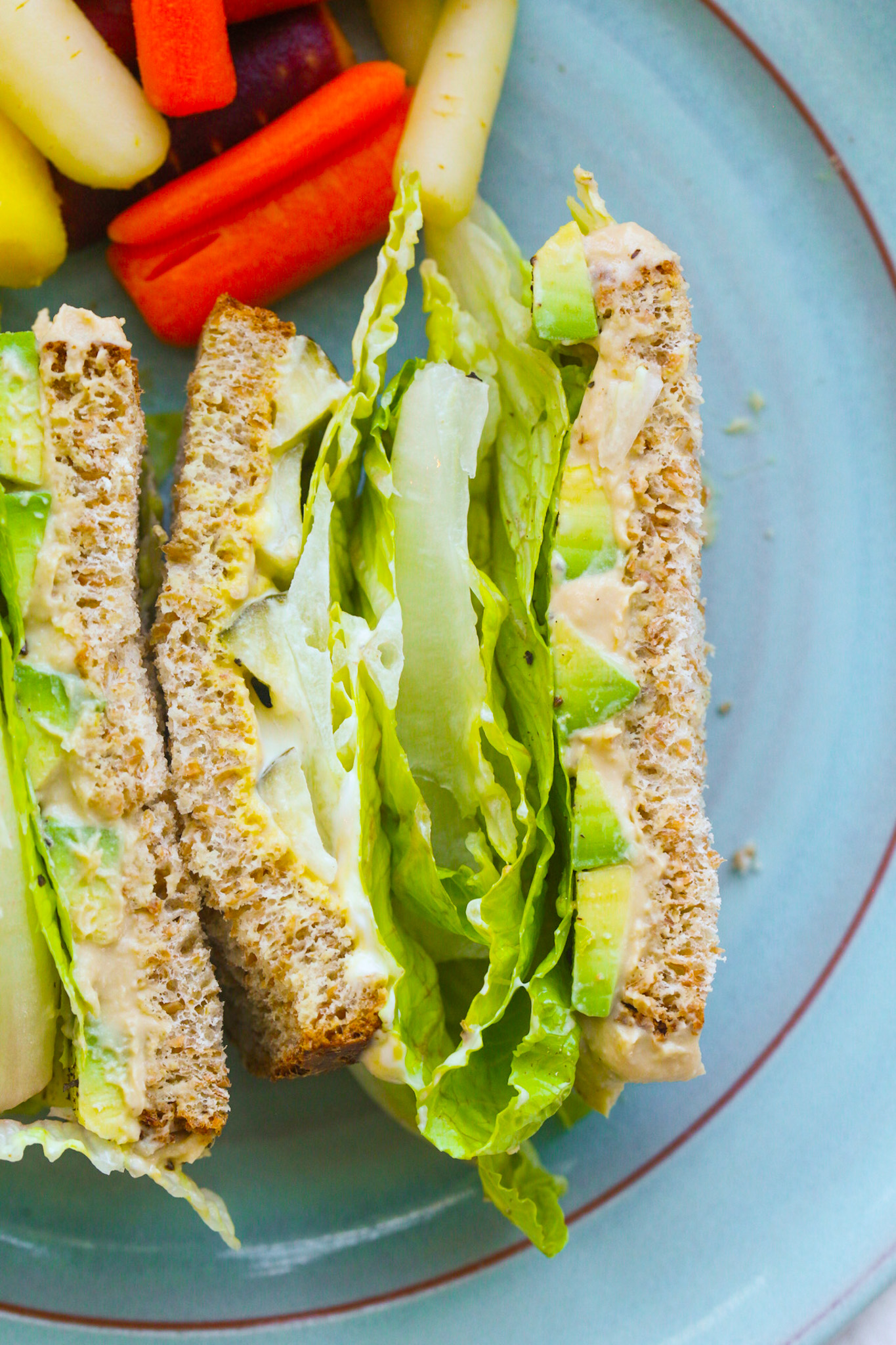 side view avocado sandwich on plate