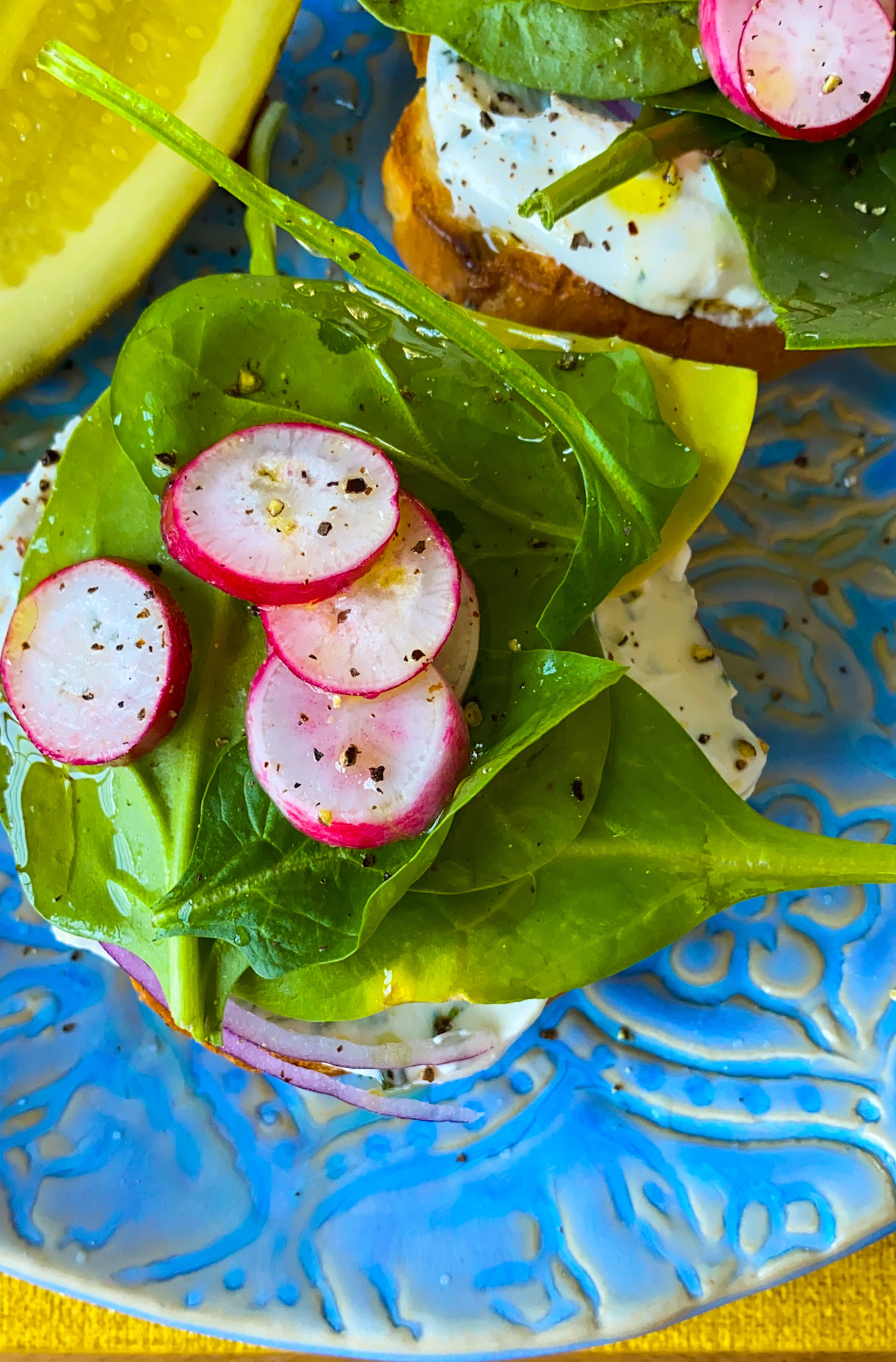 bagel with veggies on plate