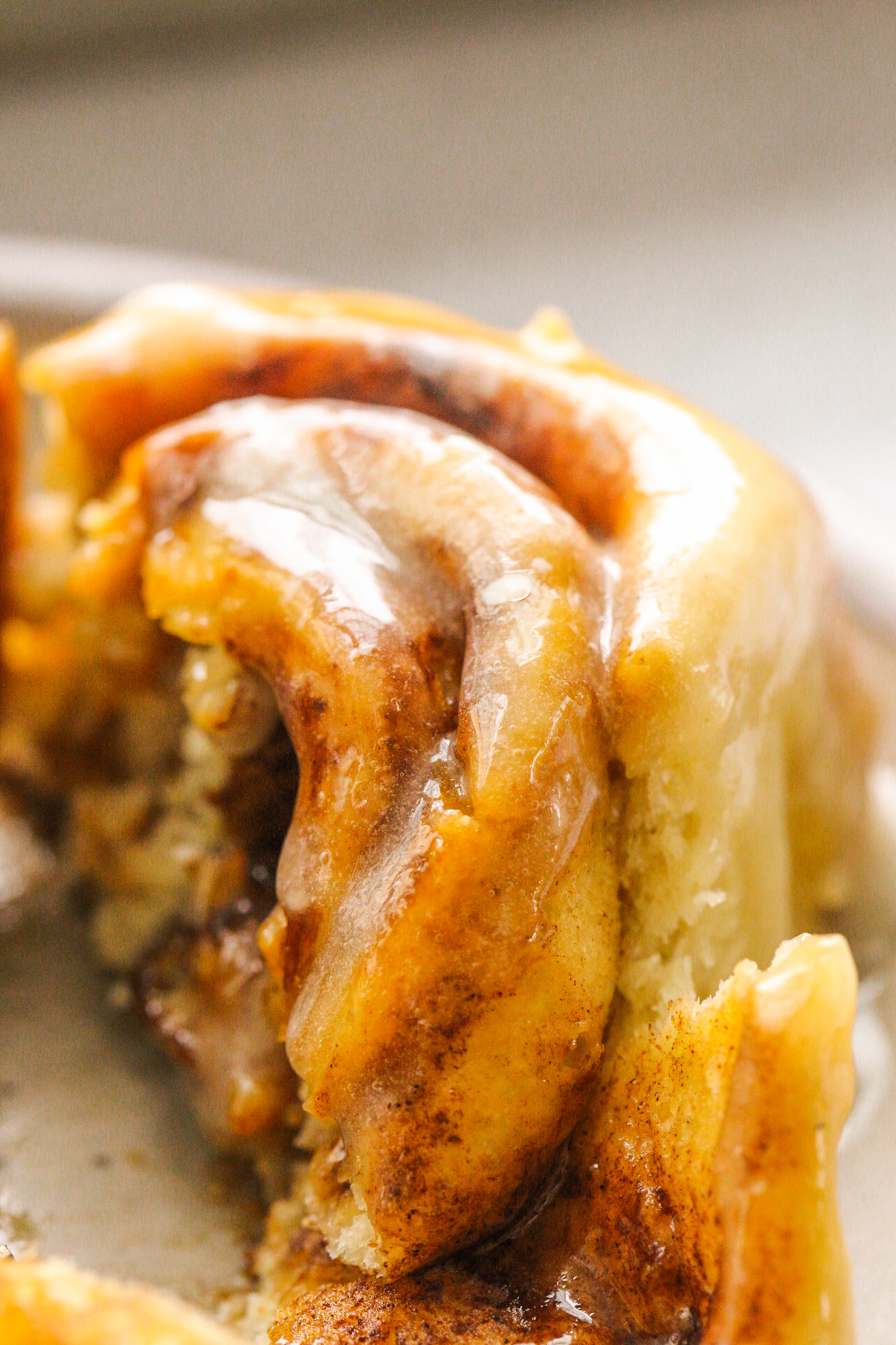 close up cinnamon roll glazed