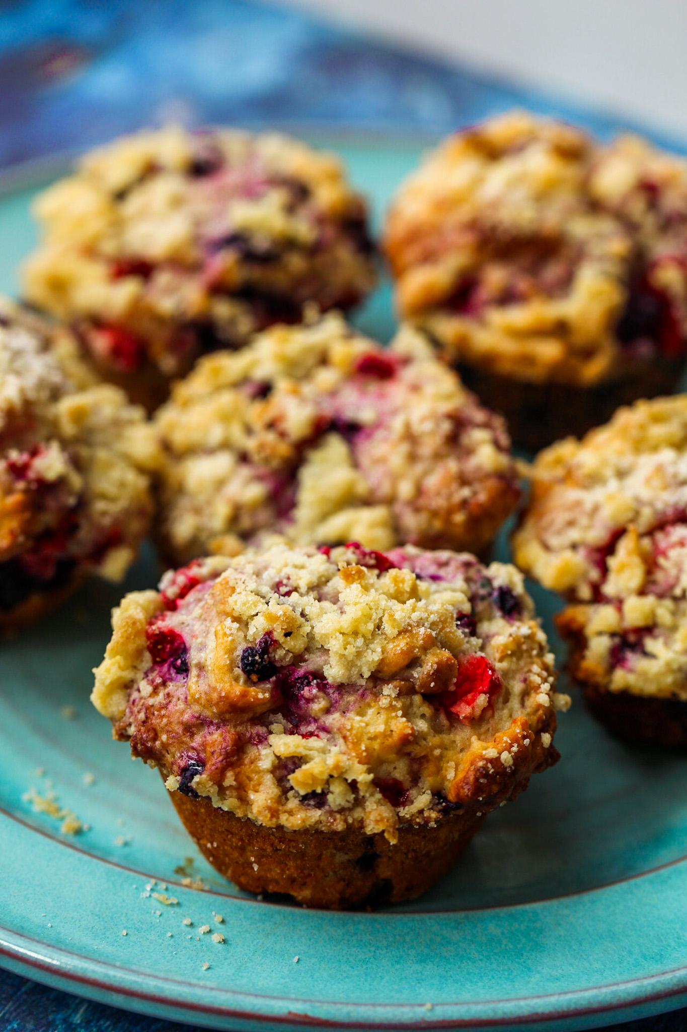 berry muffins on teal plate