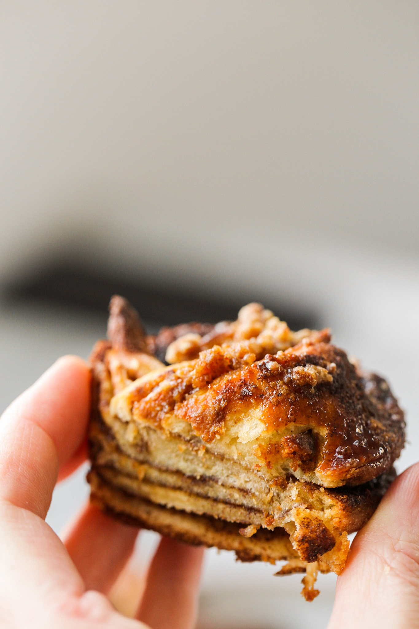 holding a mini babka sliced