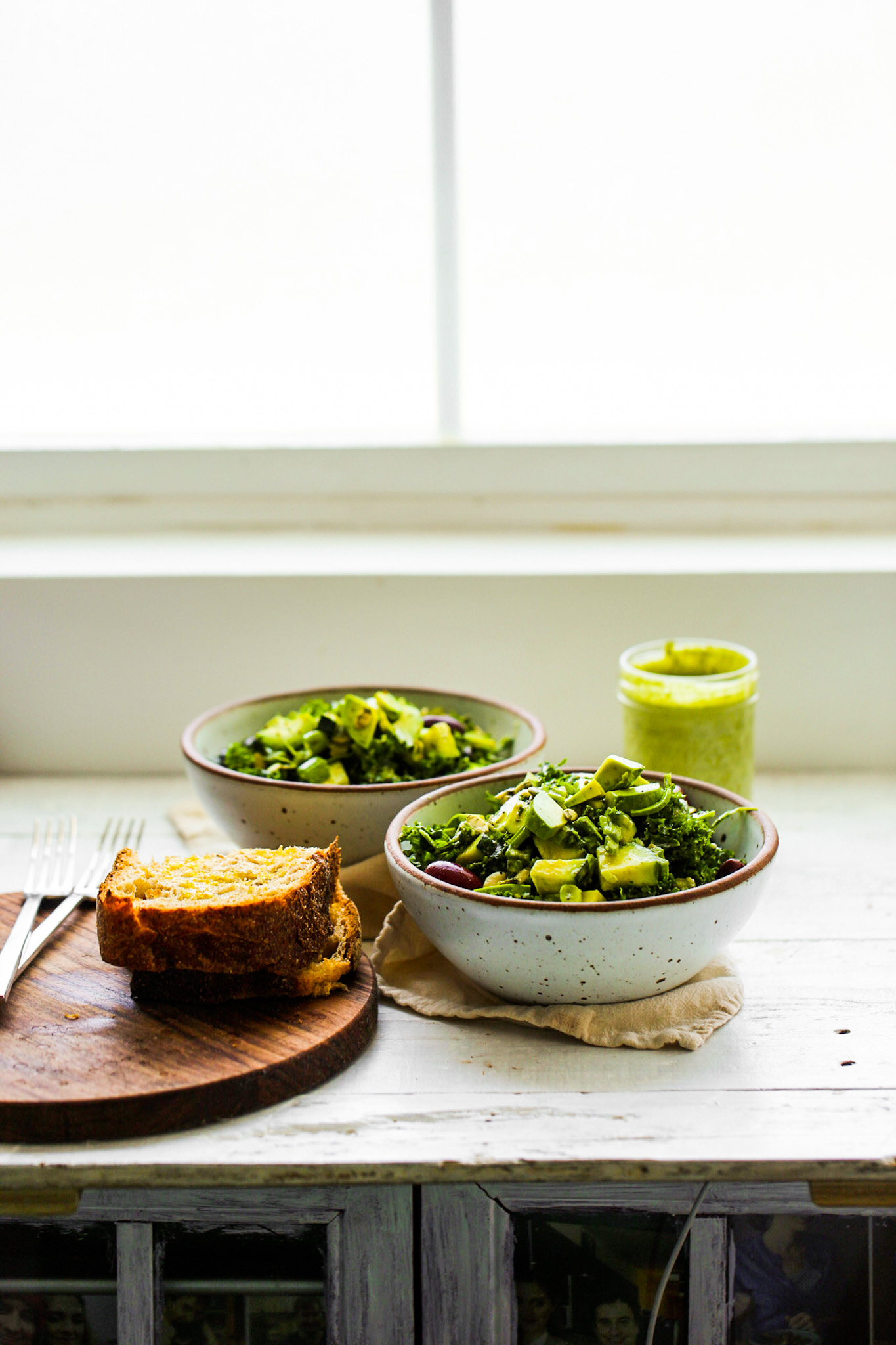 green goddess salad bowls with bread