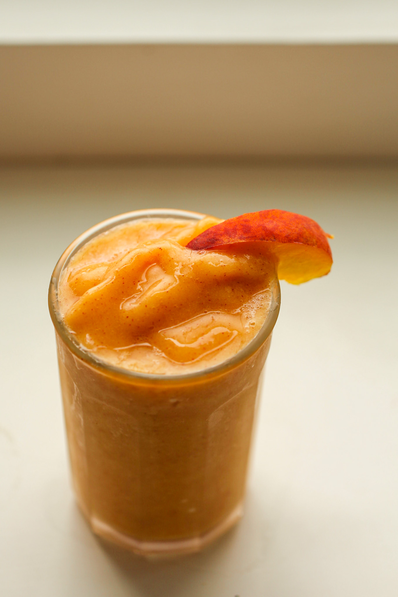 peach smoothie in clear glass