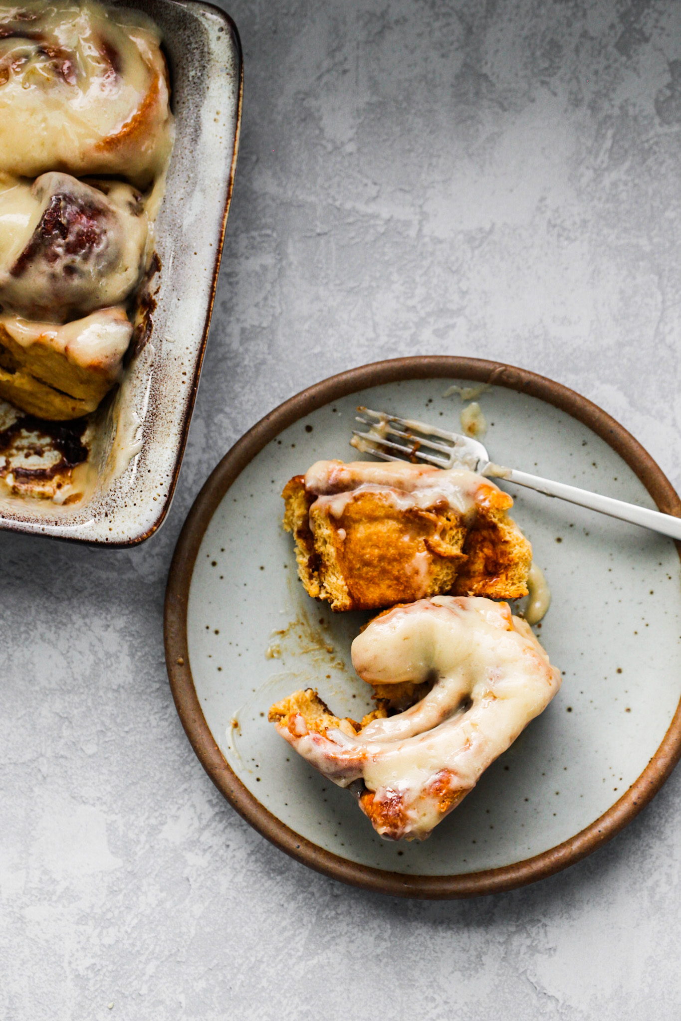 frosted cinnamon bun on plate