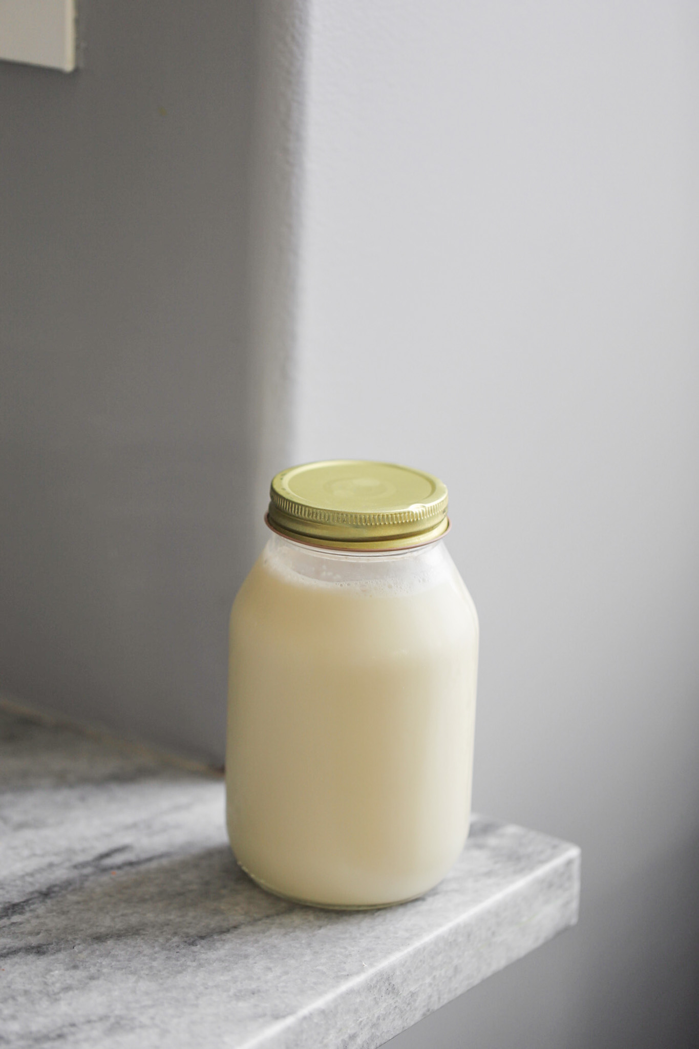 Close-up Of Soy Milk Jar. by Stocksy Contributor Martí Sans - Stocksy