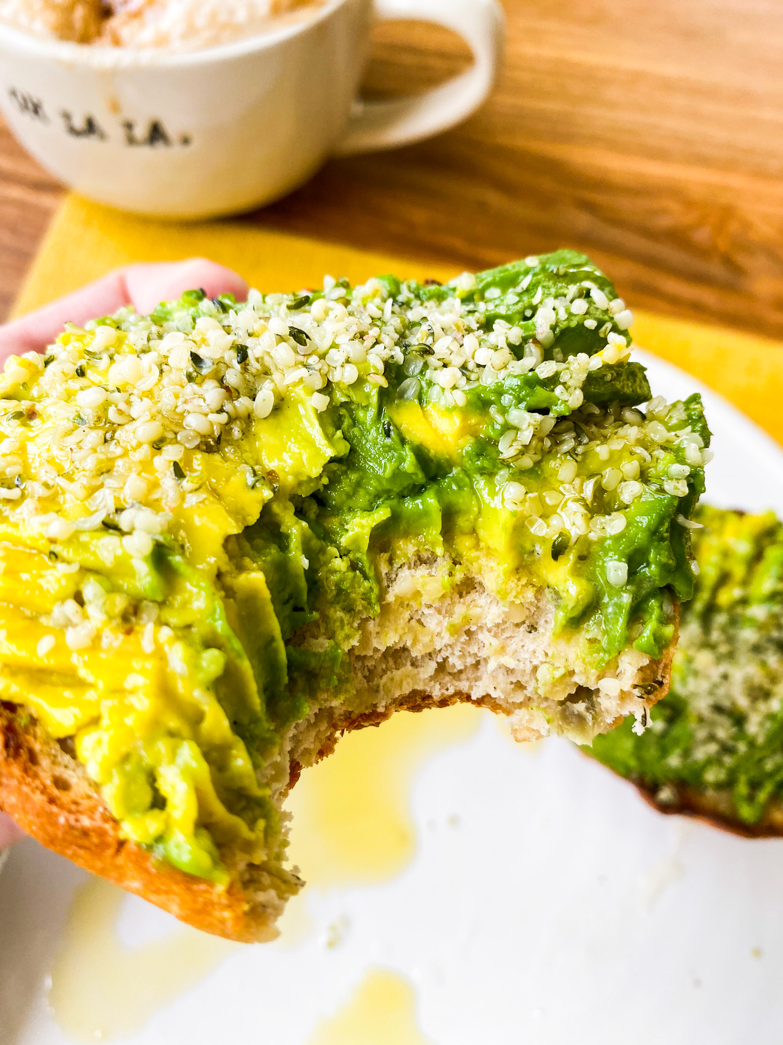 bite into bagel avocado toast