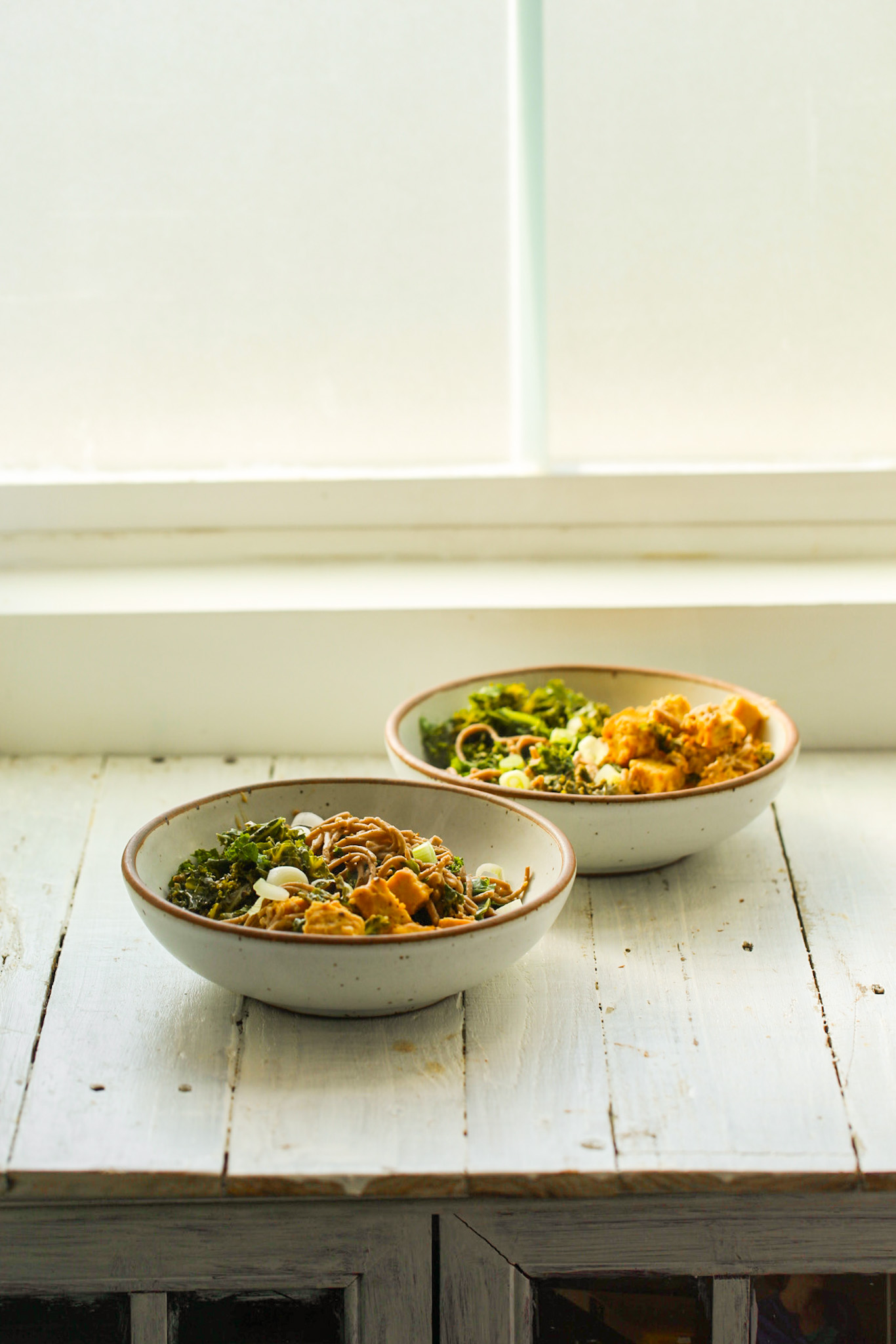 two peanut noodle bowls