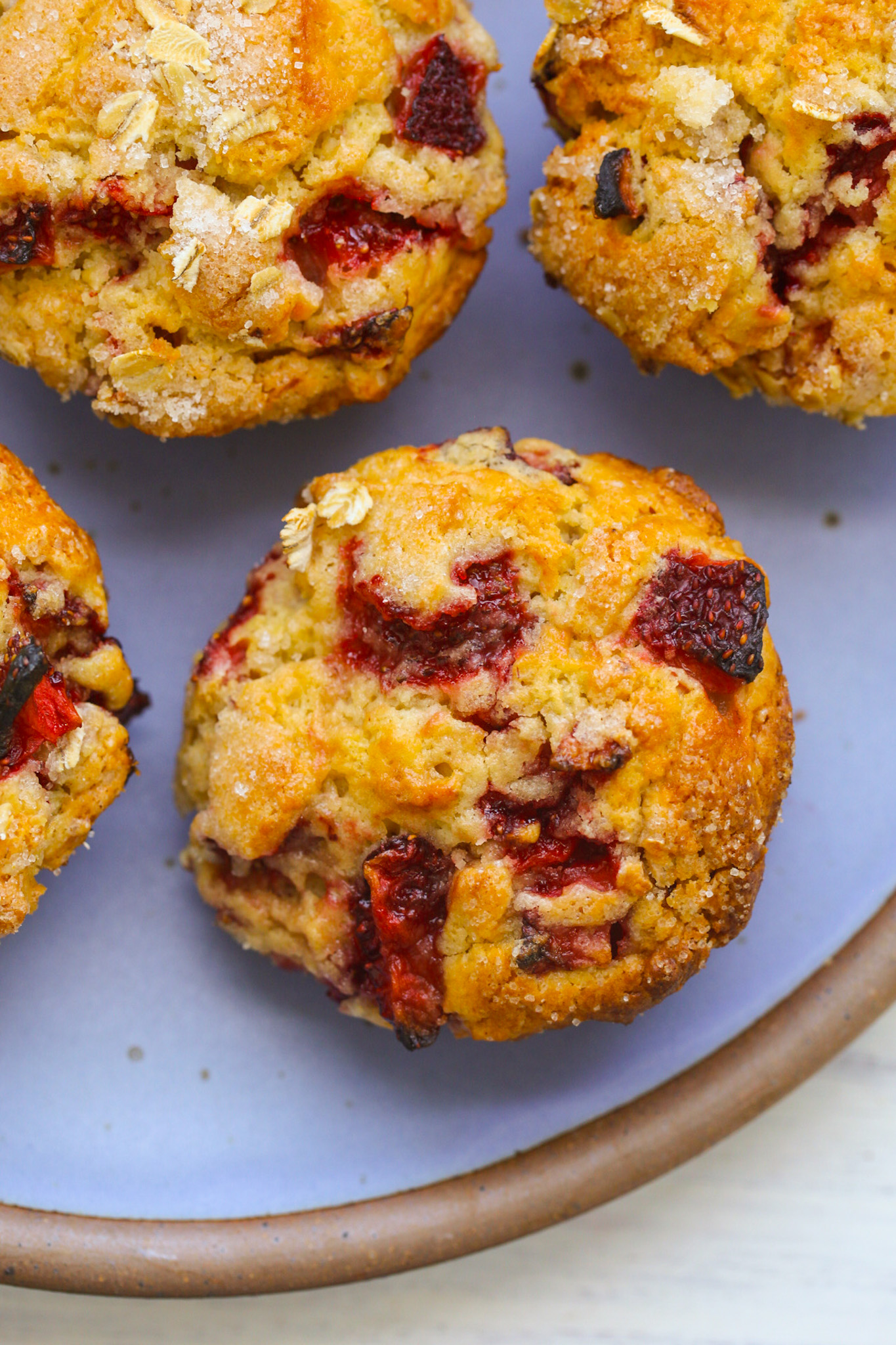 vegan strawberry muffins on blue plate