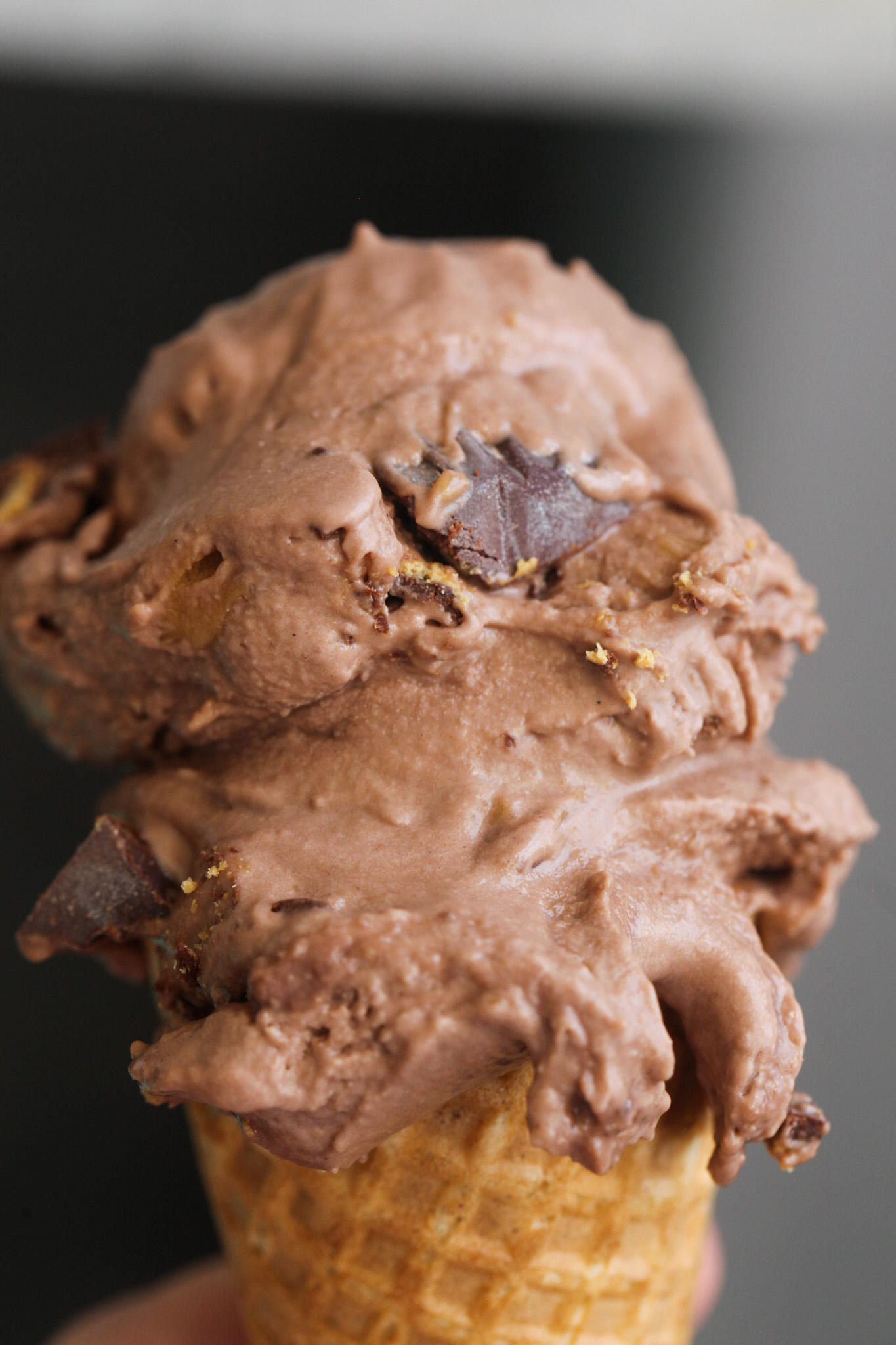 Rich and creamy chocolate ice cream on a cone