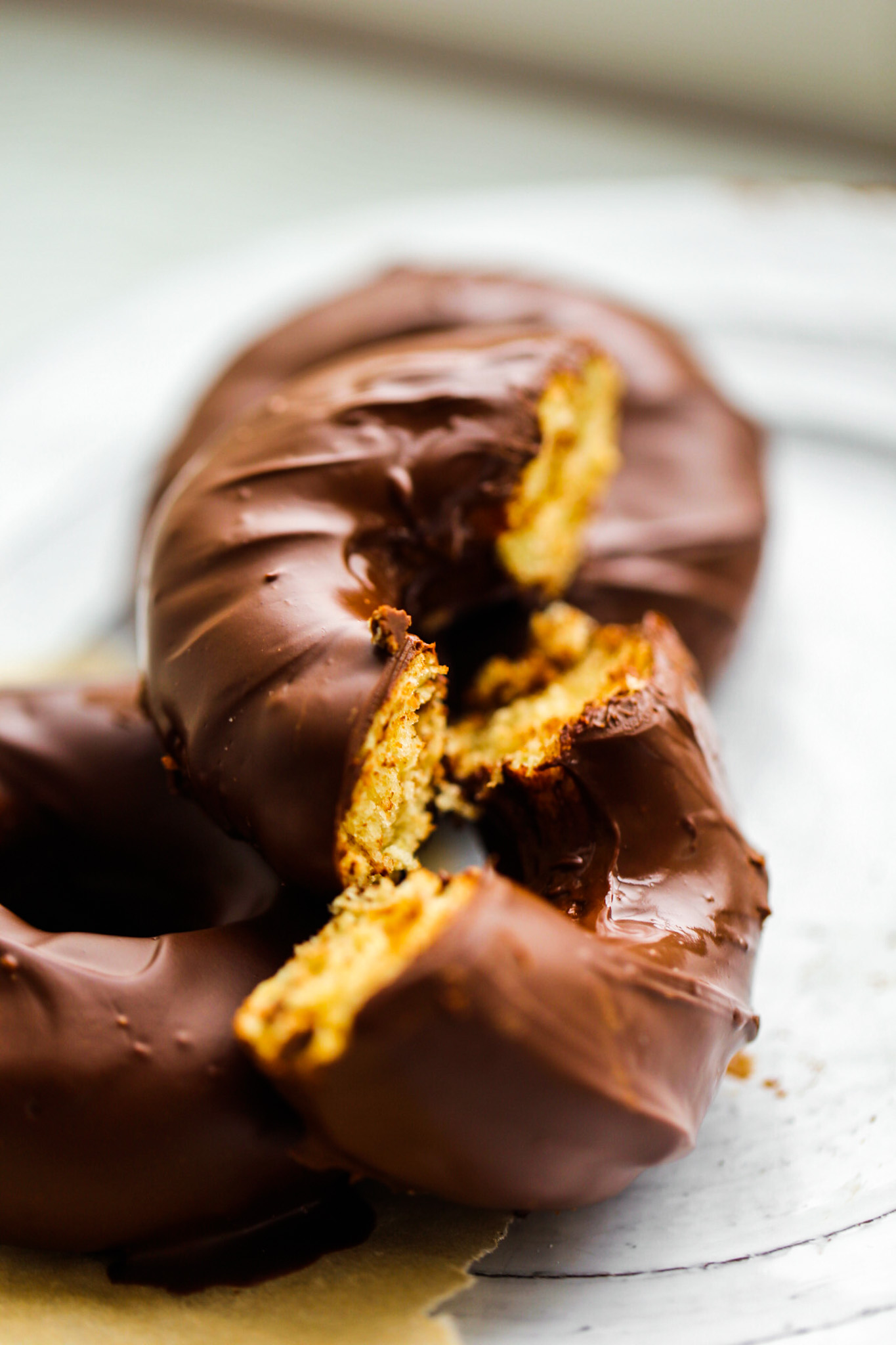 baked chocolate frosted donuts, sliced