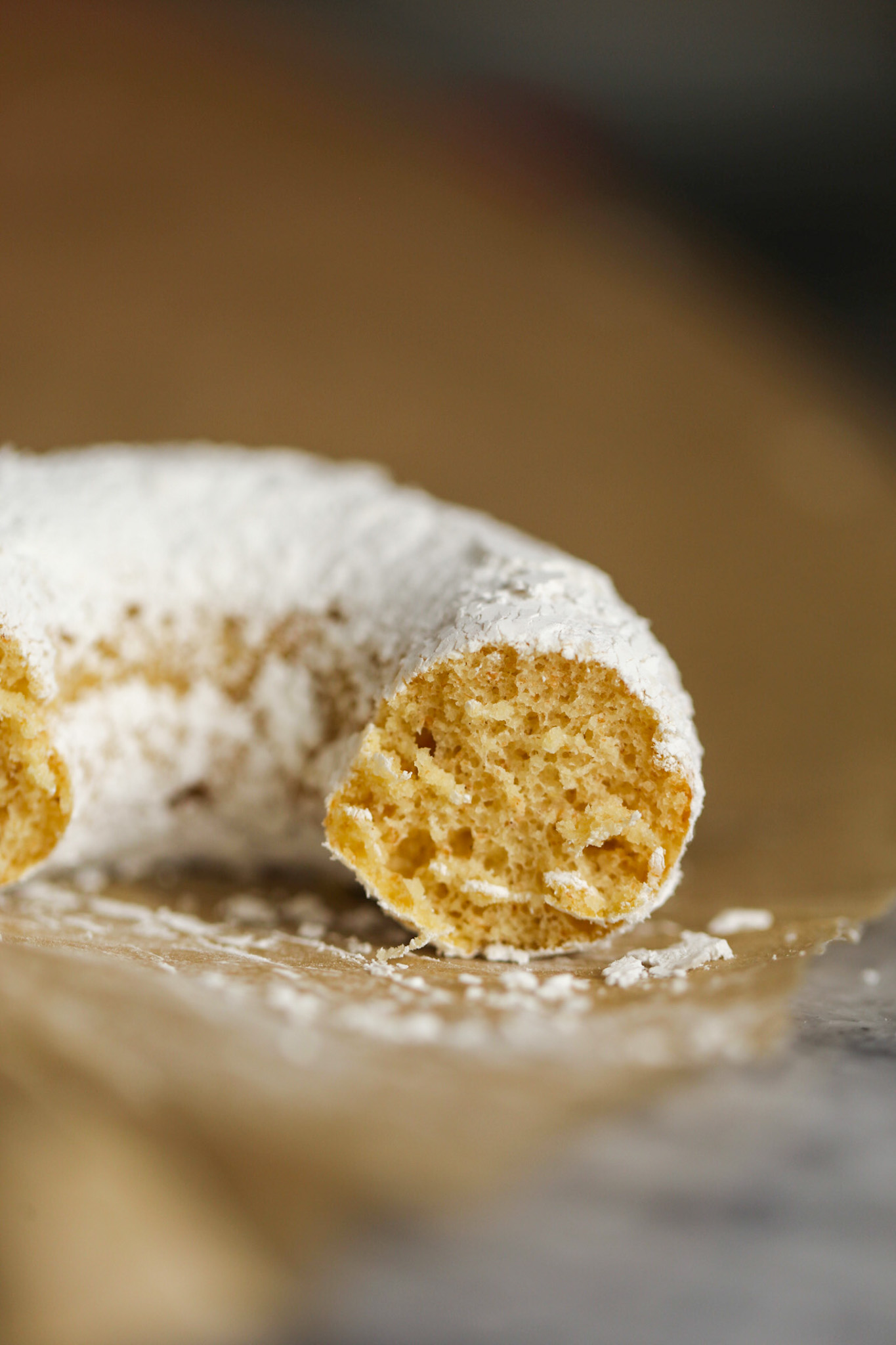 close up inside of powdered sugar donut