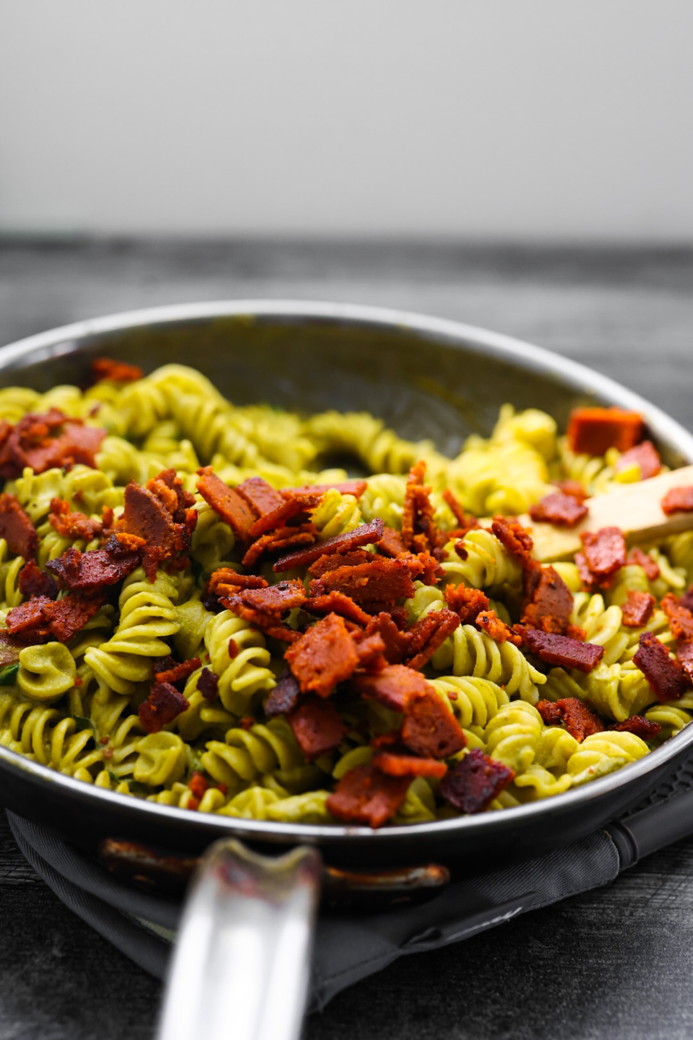 crispy vegan bacon on top pasta