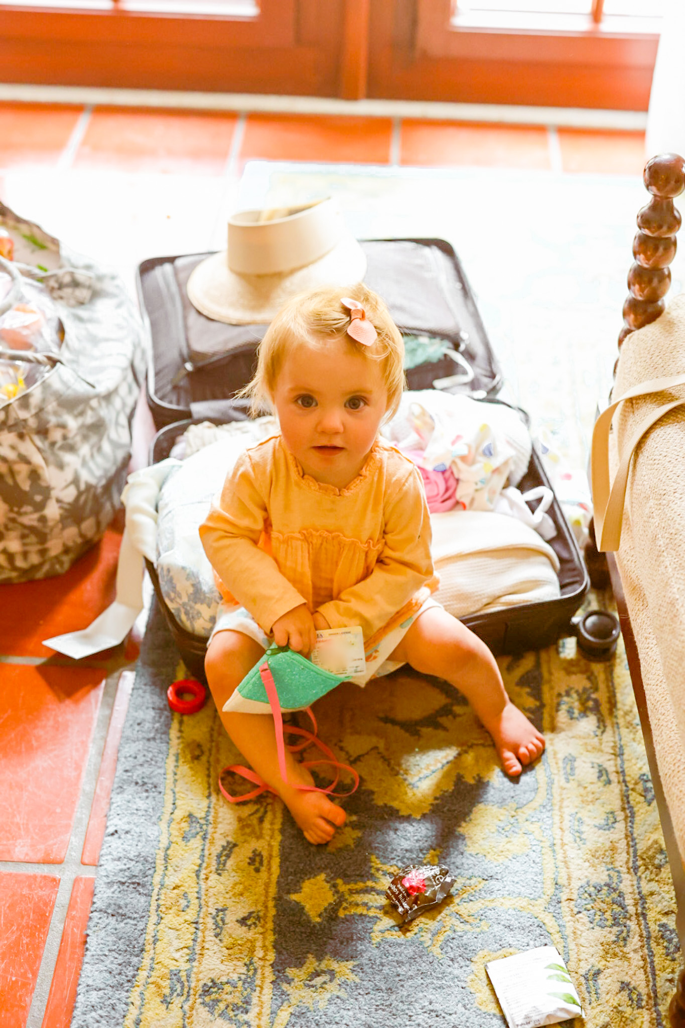 Rosalie baby road trip suitcase hotel floor