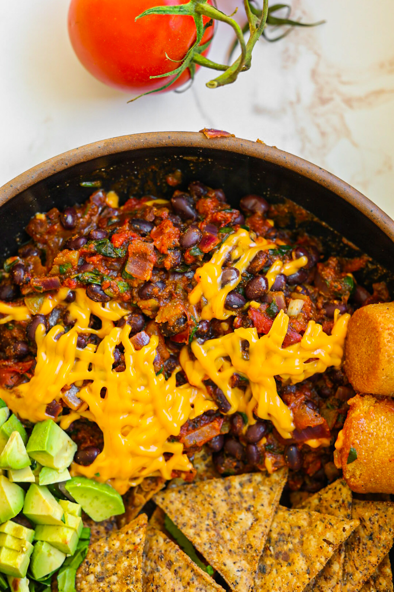 spicy stovetop beans with melted cheese