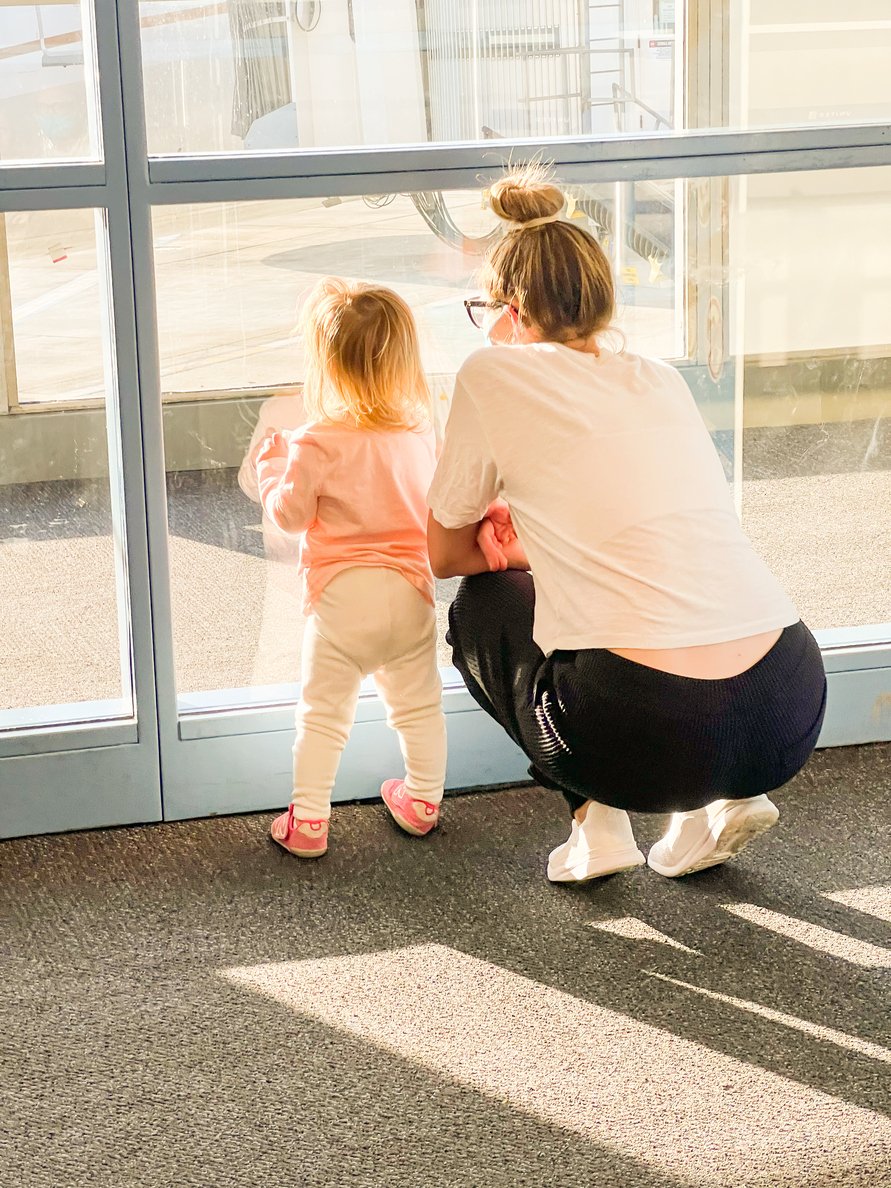 airport window gazing with toddler