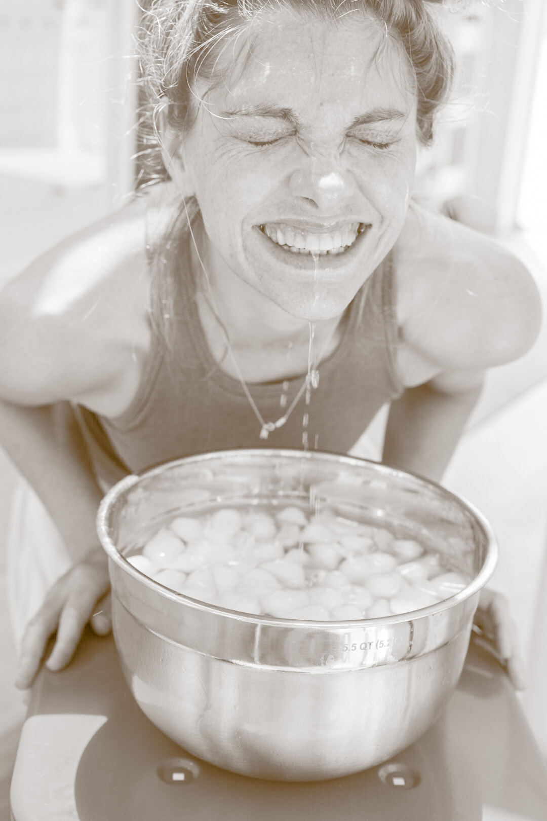 face in ice water for cold water therapy